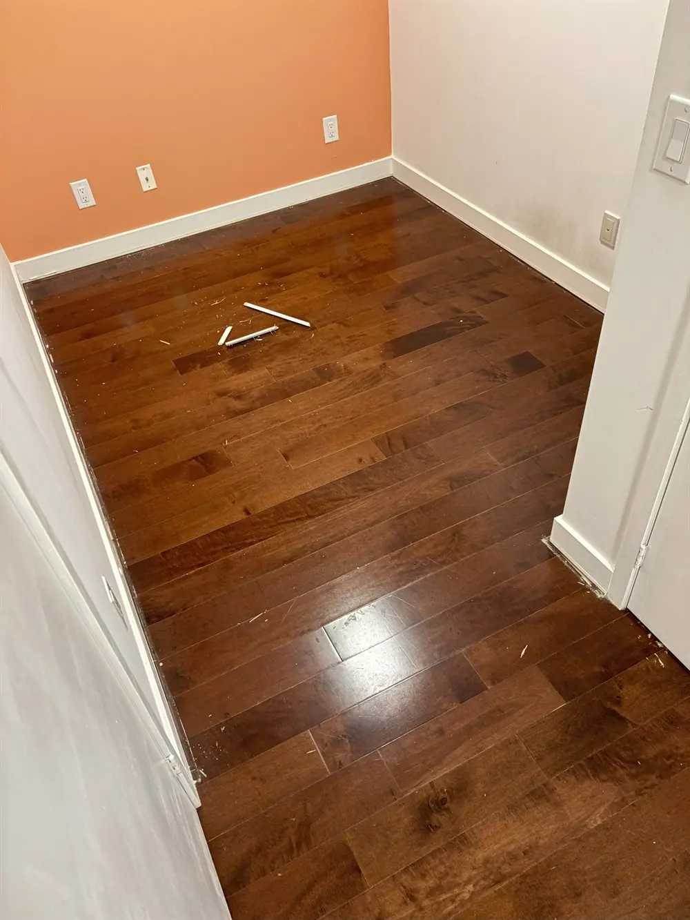Hardwood floor before sanding and refinishing in Toronto